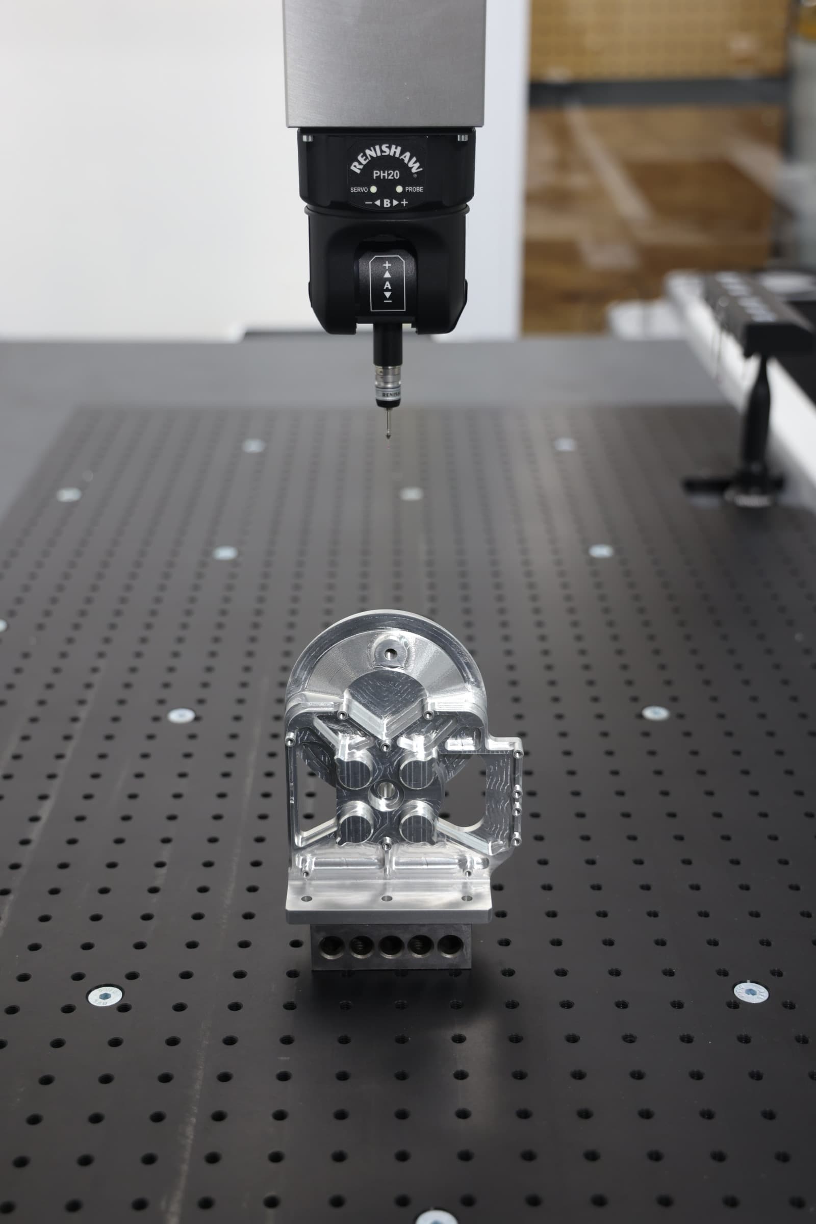 CMM probe inspecting a precision machined component