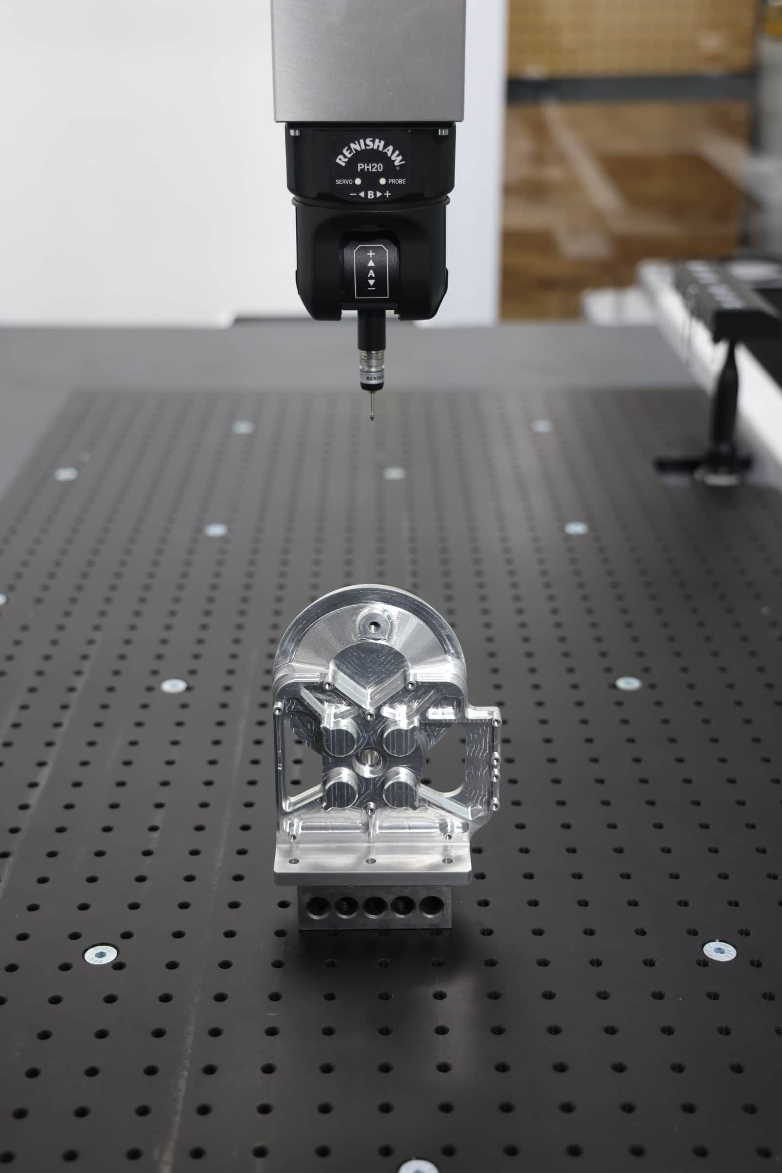 Coordinate measuring machine inspecting a precision aerospace component